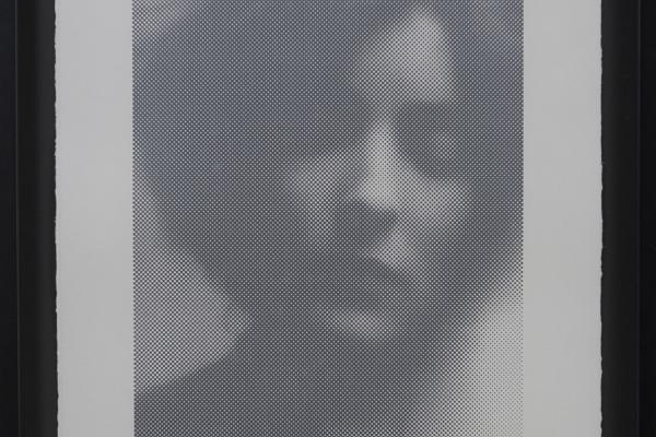 black and white print of a woman's face