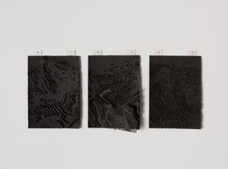 three small rectangular works on black paper