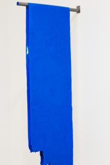 bright blue fabric hanging from a pole