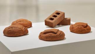 plaster sculptures of sourdough bread with bricks