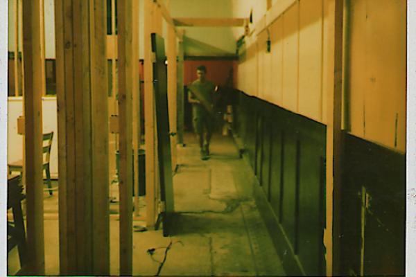 image of a polaroid of Shaun Dacey in a space under renovations