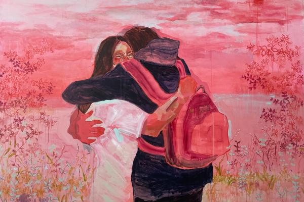 A painting of two people embracing. The figure with their back towards the viewer has a pink backpack on, they are taller than the person facing towards us. The figure facing towards teh view has dark hair and a white shirt. A red hand wraps around them lovingly. The background is slightly abstract but suggests clouds and prairie landscapes. It is mostly pink and red. 