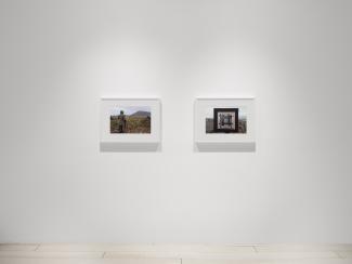 two framed photographs on the wall