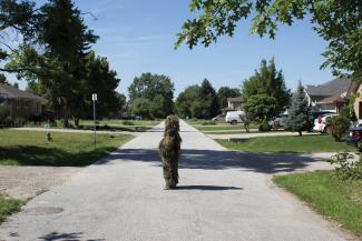Un-camouflaging #12 (Forms of Awareness: Ghillie Suit). Performance, Windsor, ON Photo: Bree Arbor. 2012. Courtesy of the Artist.