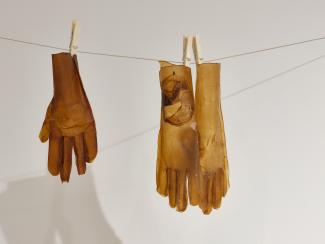 gloves made of cellulose hanging on a laundry-line