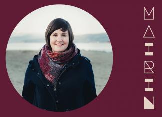 Circular image of smiling Mairin, standing on an overcast beach, placed in a maroon background with her stylized name in pale peach to the right.