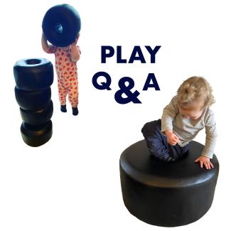 image of a toddler playing with a large sculptures of black beads against a white background. Text reads Play Q & A
