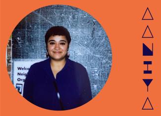 Circular image of polaroid of Aaniya, wearing a navy shirt smiling, standing against a large map background. The portrait is placed in a dark orange background with her stylized name in navy blue to the right.