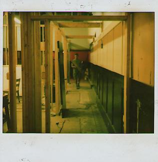 image of a polaroid of Shaun Dacey in a space under renovations