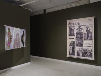 One canvas print and a pastel-toned silk print hang in the gallery. 